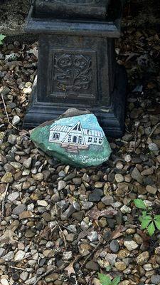 a painting of the building on a rock