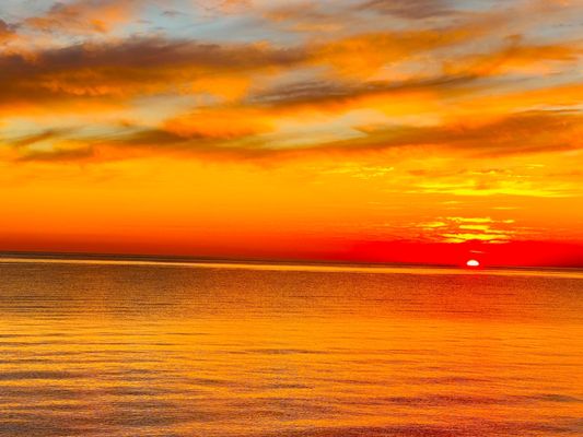 View from outside patio table... beautiful sunset over Lake Ontario