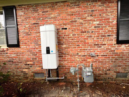 We had a tankless gas water heater installed on the exterior of our home