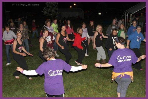 Zumba in the Park at Relay for Life.  Curves Team Purple Power leads.