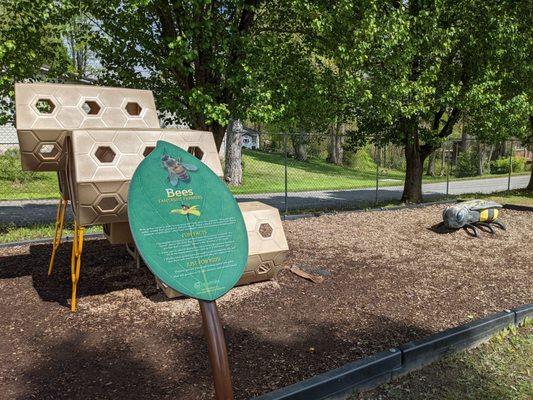 Super cute lower nature play area. Learn about nature while playing! What could be cooler? This station is about bees.