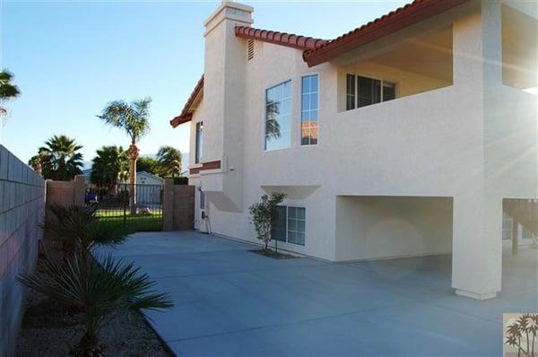 Rebuilt side of the house, stucco, paint, new hardscape and deck after fire.