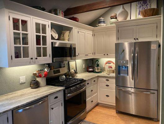 Beaded inset cabinetry, with raised paneled doors.