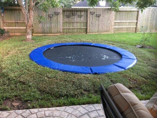 Trampoline set several feet away from the covered patio. I added some flagstone to transition between the patio and trampoline.