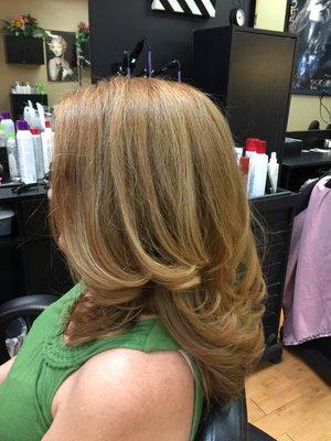 A beautiful natural looking honey blonde, done with Paul Mitchell The Color