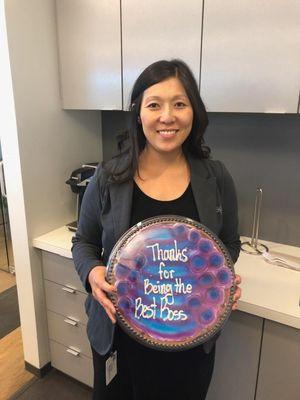 Celebrity Staff Omaha Branch Manager, Pam H. flaunts her "Bosses' Day" cookie given to her by her team.