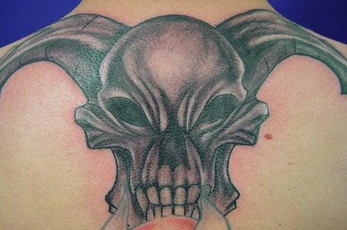 Skull by Chuck Kail Alley Cat Tattoo Studio