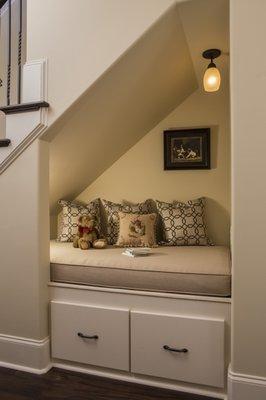 Children's Nook Under Stairs. Home located in The Thistle, Sunset Beach North Carolina. Interiors Legacy Interiors