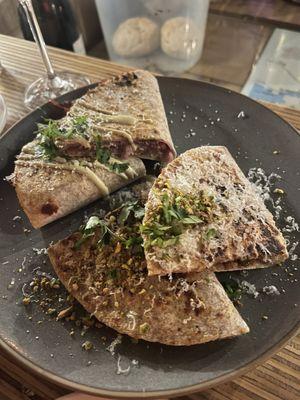 Prosciutto parm quesadilla on the left and shrooms Comte quesadilla on the right