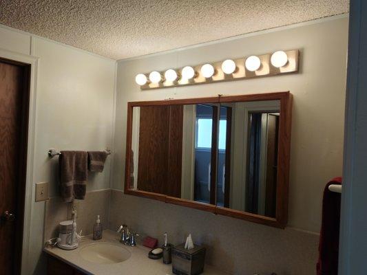 New popcorn ceiling was placed along with fresh paint and new lights.