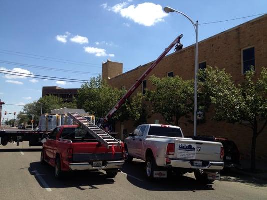 WBI General Contractors replacing roof on Crush Restaurant and Davidson Oil Building Amarillo, Texas. Roof Loading Materials