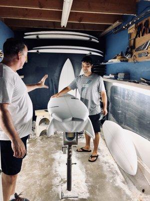 Explaining the process of making his board