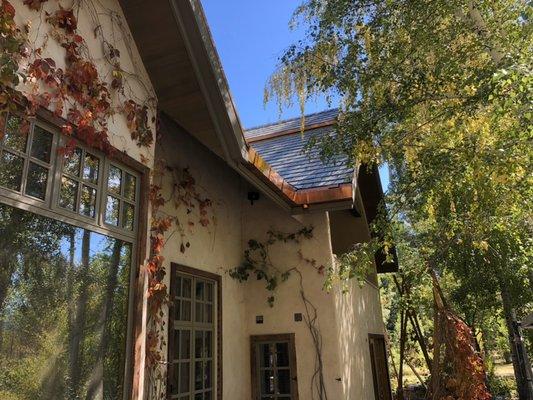 Slate roof with custom copper gutters