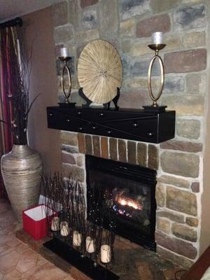 Features such as this beautiful fireplace and custom made mantel is something to look at