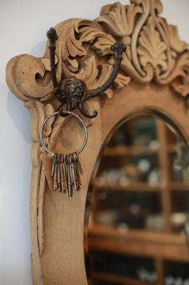 A collection of Vintage keys hanging from one of the beautiful furniture offerings in shop.