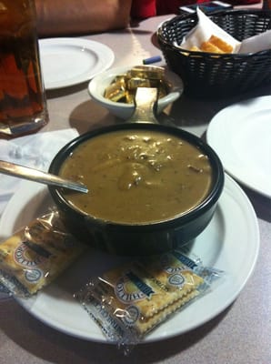 Beef stroganoff with a bread basket.