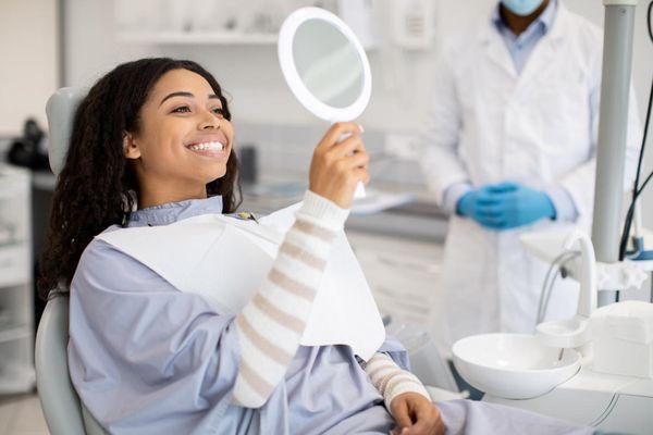 Happy Absolute Dental Patient after their dental visit.