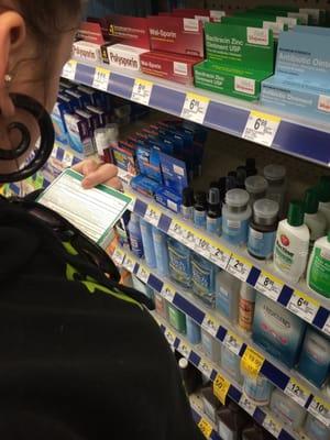 My girlfriend and I looking through the first aid area for tattoo ointment