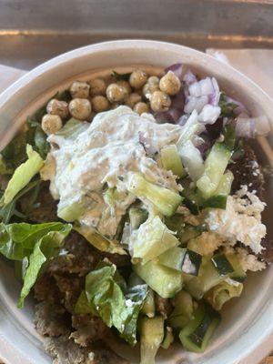 Gyro salad with yellow rice, chickpeas and more