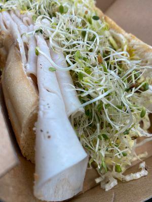 Turkey, avocado and sprouts with cream cheese.