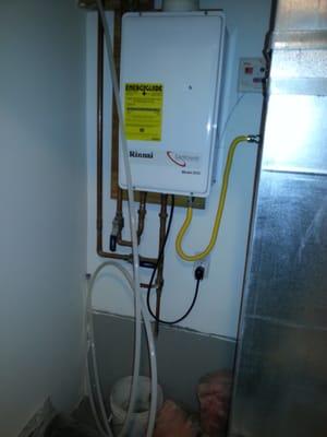 Tankless water heater install along with recirculating pump.