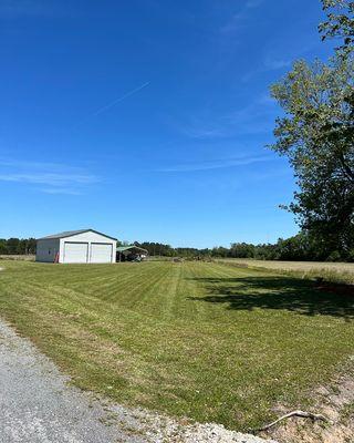 Yard that we manage in Hemingway, SC. Basic lawn care services and trimming around buildings and house.