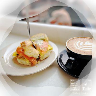 Salmon, avocado and egg sandwich with cappuccino