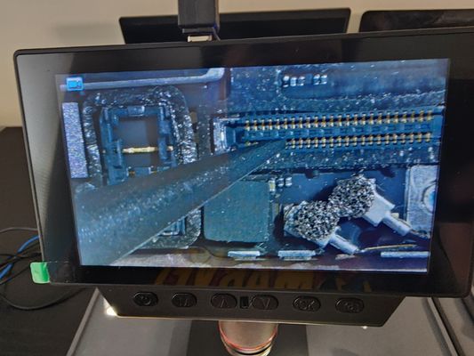 Using Microscope to carefully examine the motherboard for any physical and visible damage on Motherboard during diagnostic process.