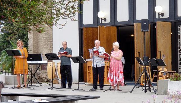 Our Worship Team sings outside. They are 30 feet from the gazebo where Pastor preaches.