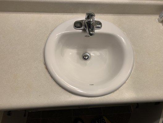 Bathroom sink after 
 Cleaning.