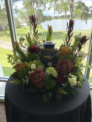 Flowers surrounding urn