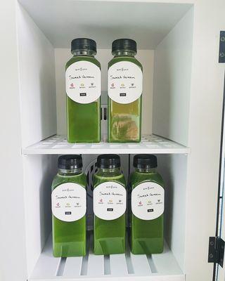 Bottles of Sweet Green in a fridge at Rum Runners Bakery