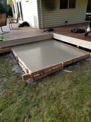 Concrete pad for hot tub.