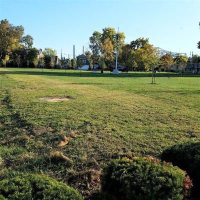 A groomed lawn covers the park