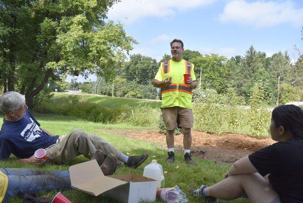 City of Scandia staff educating volunteers about how to properly plant perennials and trees at the corner of Highway 97 and Olinda Trail.