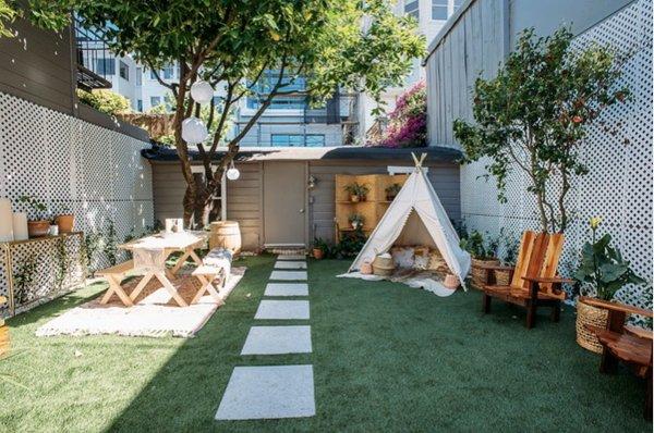 Backyard Bliss! Come hang out before your appointment...grab yourself a complimentary drink!