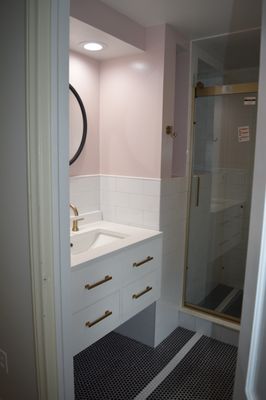 Bathroom Renovation Summit Nj Restoration Hardware vanity, black and white penny tile floor , Subway tile wall. Georges bright lighting