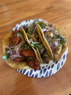 Al pastor, carne asada, and chicken tacos