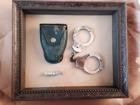 My Frame Shop did a fabulous job putting this display box together for me... it has my grandfather's handcuffs circa 1965ish.