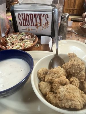 Calf fries with a really good white gravy. Salad is in background.