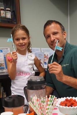 Sampling healthy smoothies in the office.