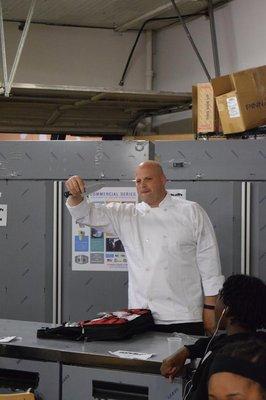 Ypsilanti Schools students recieve lunch and a demonstration from Dorsey Schools Chef @ Peoples Restaurant Equipment Company.