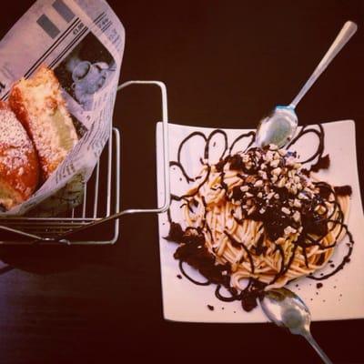 Salted caramel "spaghetti" with brownie bits and chocolate shell swirl and pistachio donut sandwich