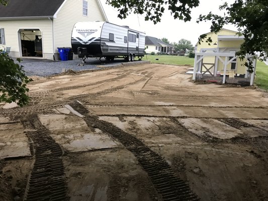 Grading in preparation for an additional driveway/ parking area