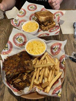 Pulled pork sandwich, ribs, and bbq pork