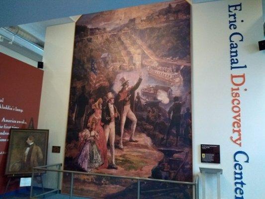 The large mural depicting the opening of Lockport's namesake at the Erie Canal Discovery Center.