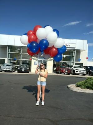 Andrea hanging balloons in the Summer of 2011