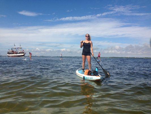 Paddle boarding fun in the sun at top of Estero Island in Fort Mayer's Beach