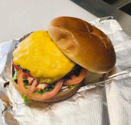 Loadmaster burger with tomatoes and lettuce.