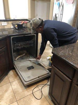 Draining the standing water in the dishwasher. Which means there was a issues with the drain pump.